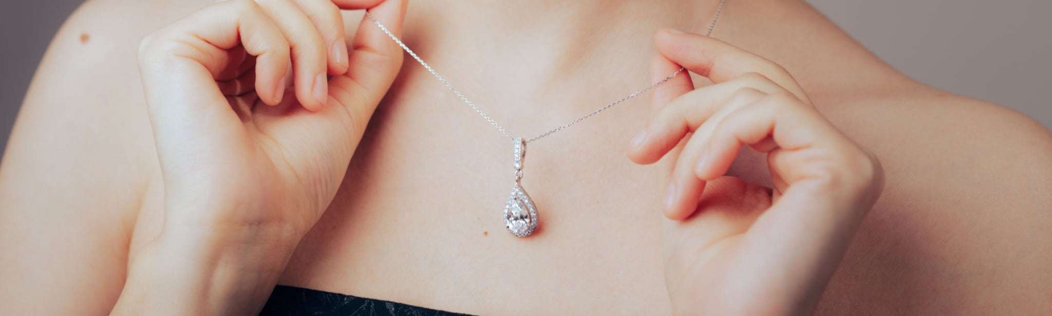 Model Showing Her Beautiful Necklace with Diamond Pendant