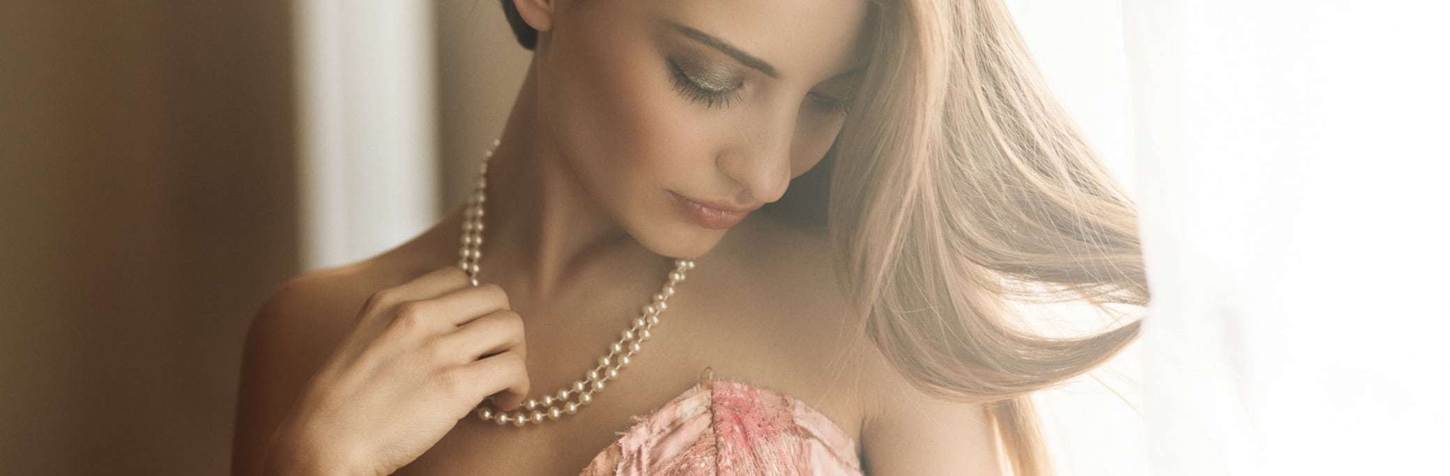 beautiful woman wearing pear jewellery