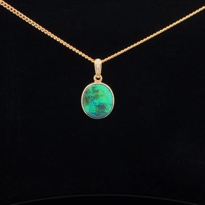 Stunning Black Opal with a green tint on a gold chain